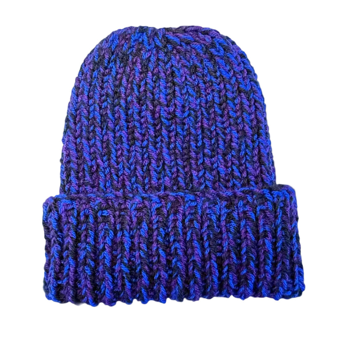 A chunky hand-knit beanie hat in a variegated black, blue and purple yarn, displayed laid flat.