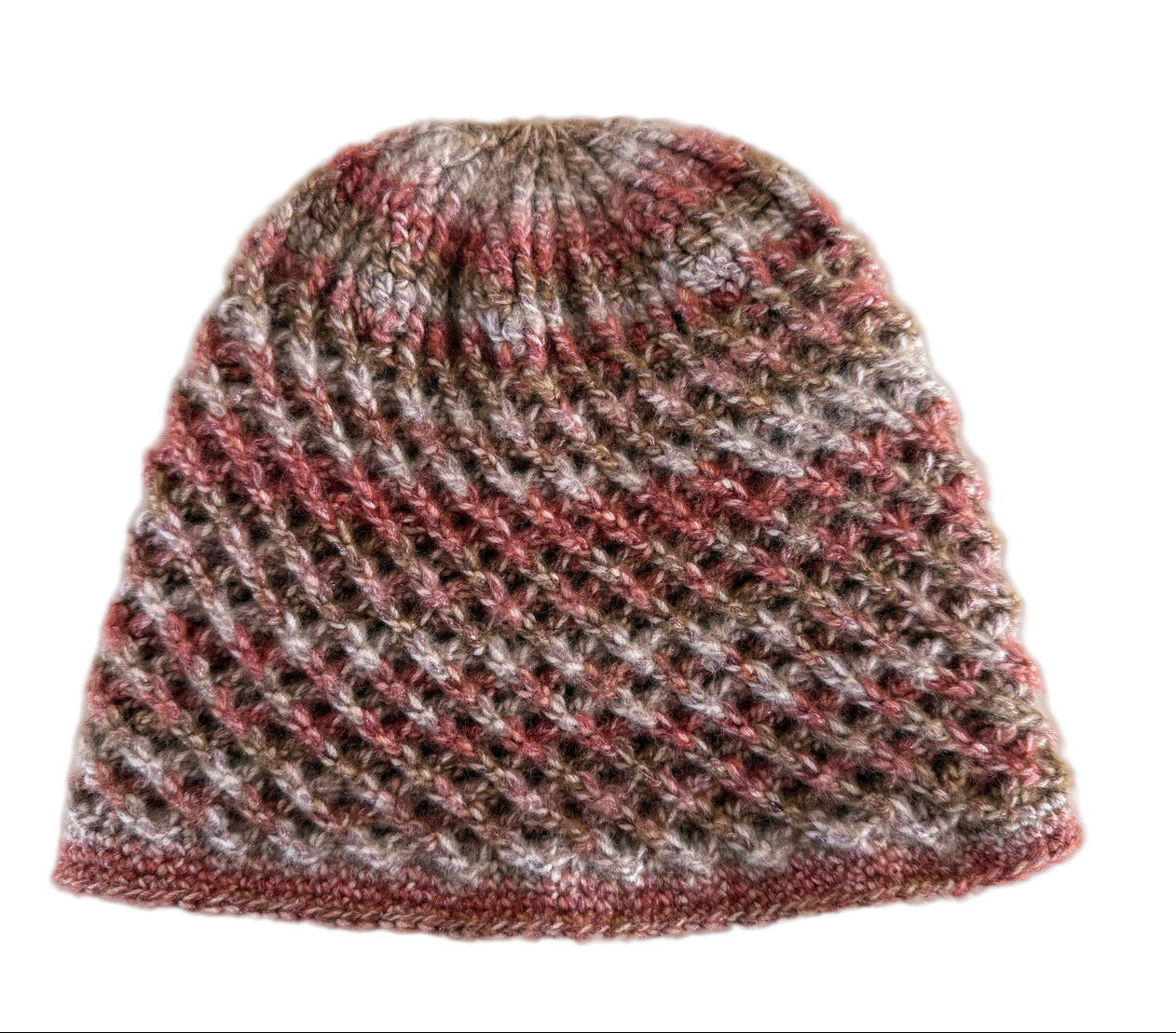 A handmade crochet spirograph beanie in red, brown, and beige shades laid flat