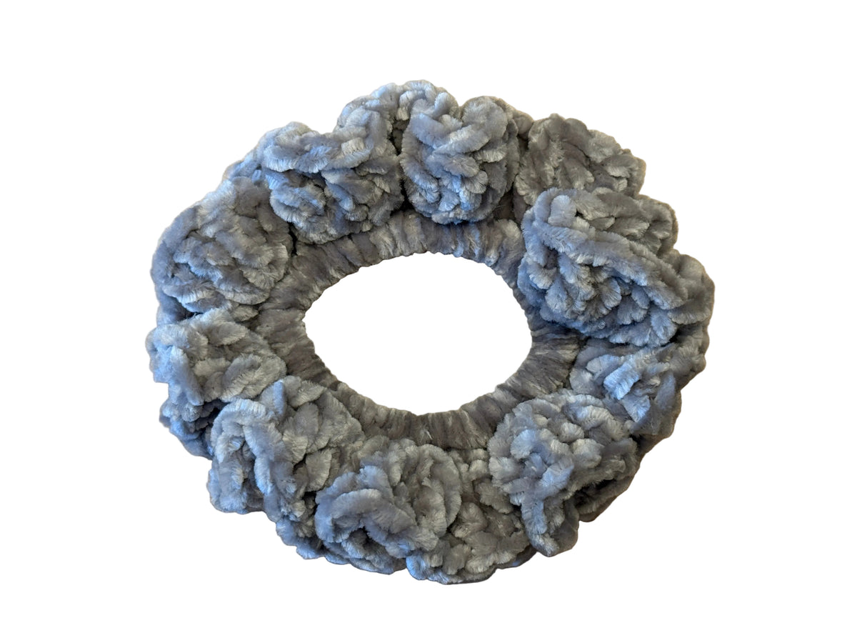 Grey scrunchie on a white background